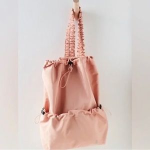 New without tags Free people pale pink featherweight sling bag